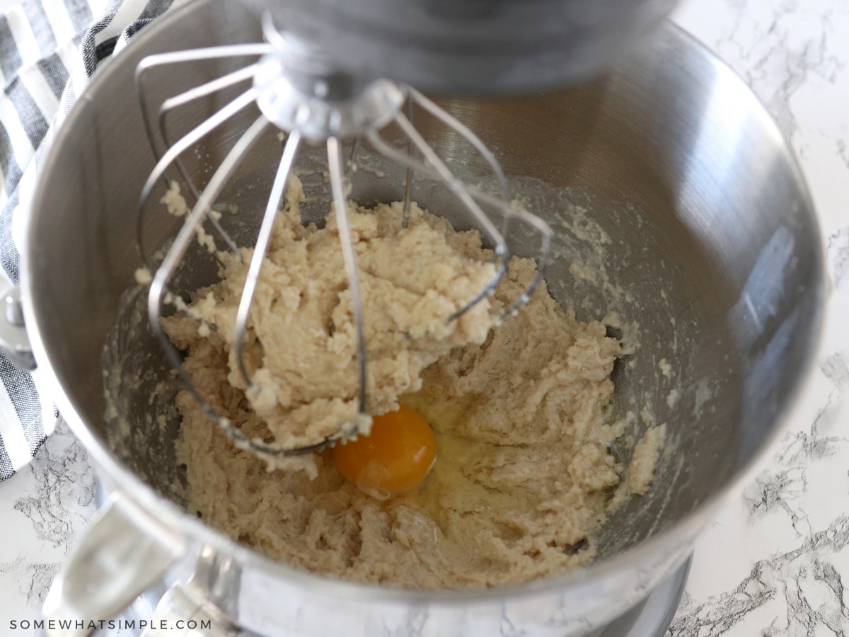 adding egg to orange roll dough