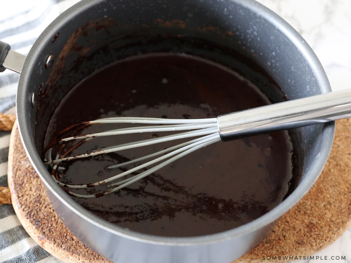 mixing hot cocoa in a sauce pan on the stove