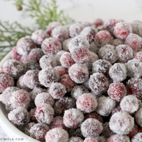 sugared cranberries in a white bowl