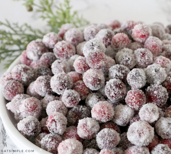sugared cranberries in a white bowl