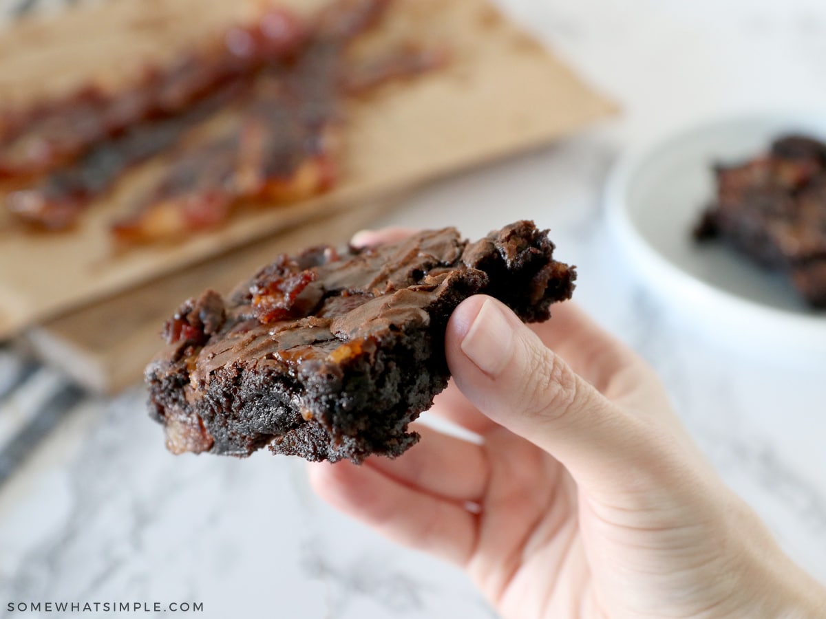 hand holding a bacon brownie 
