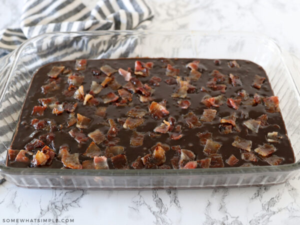 adding candied bacon to brownie mix