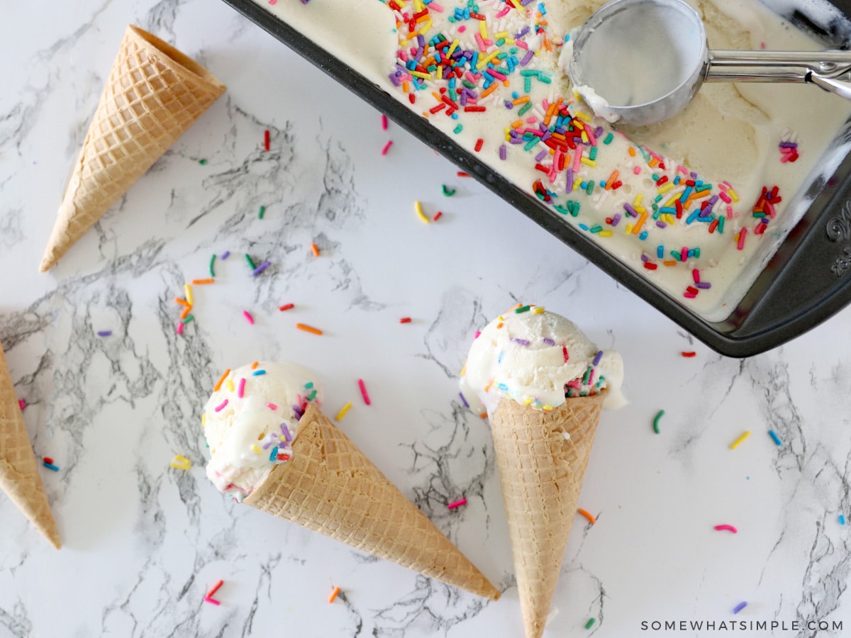 birthday cake ice cream in cones on a counter