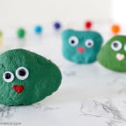 green rock painted green with googly eyes and a heart mouth - a blarney stone craft for kids