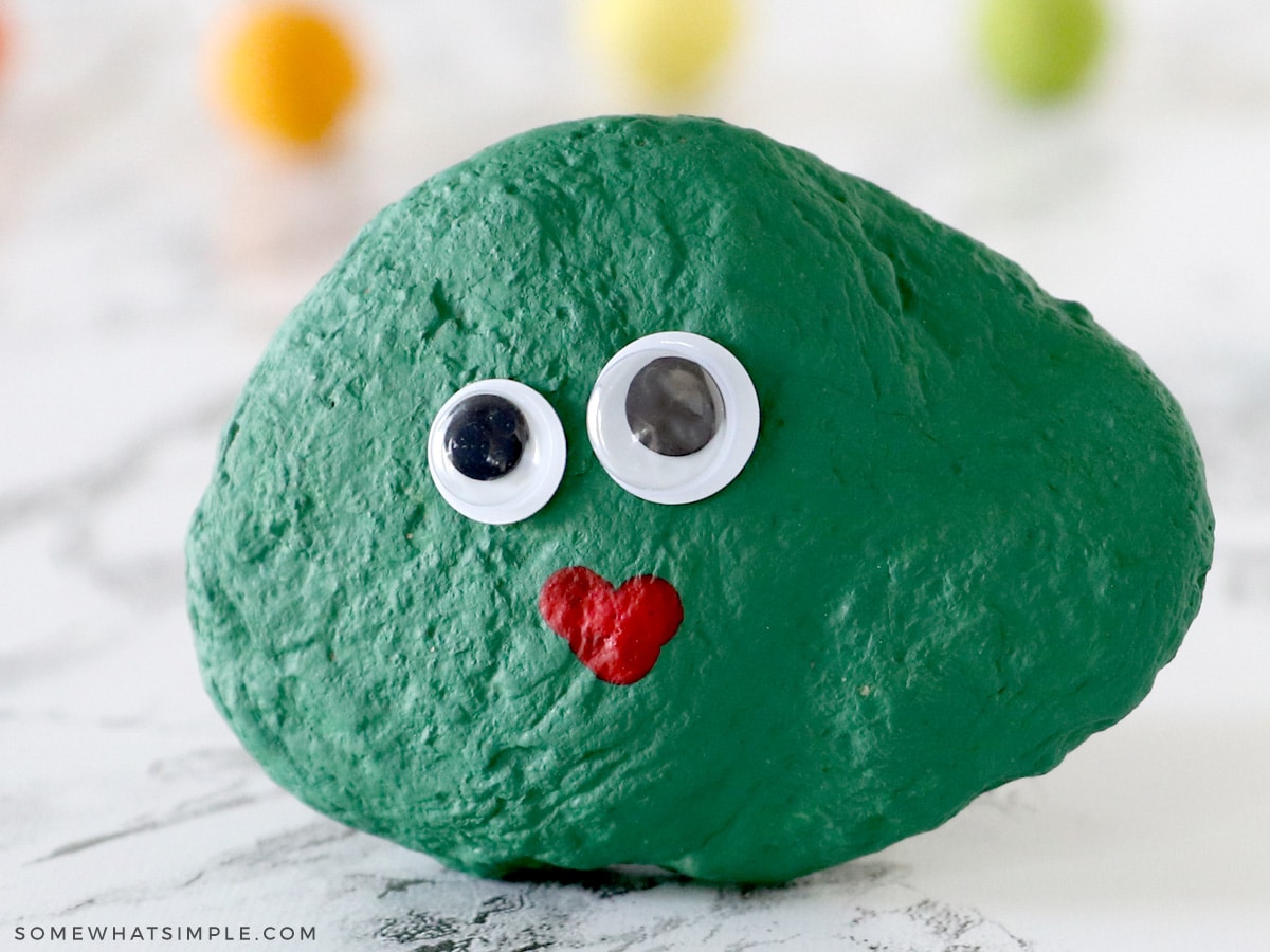 close up of a green river rock made into a blarney stone craft