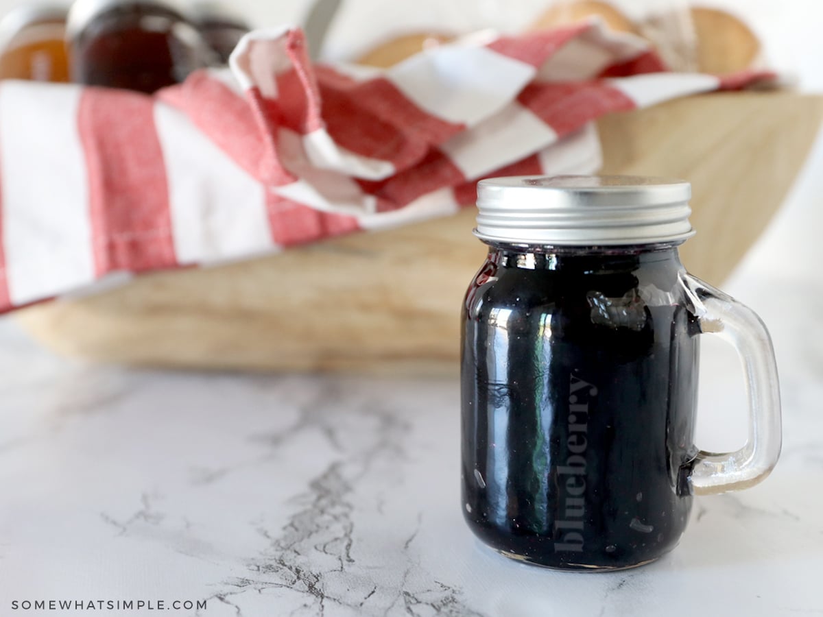 glass jelly jar with gift basket in bacground