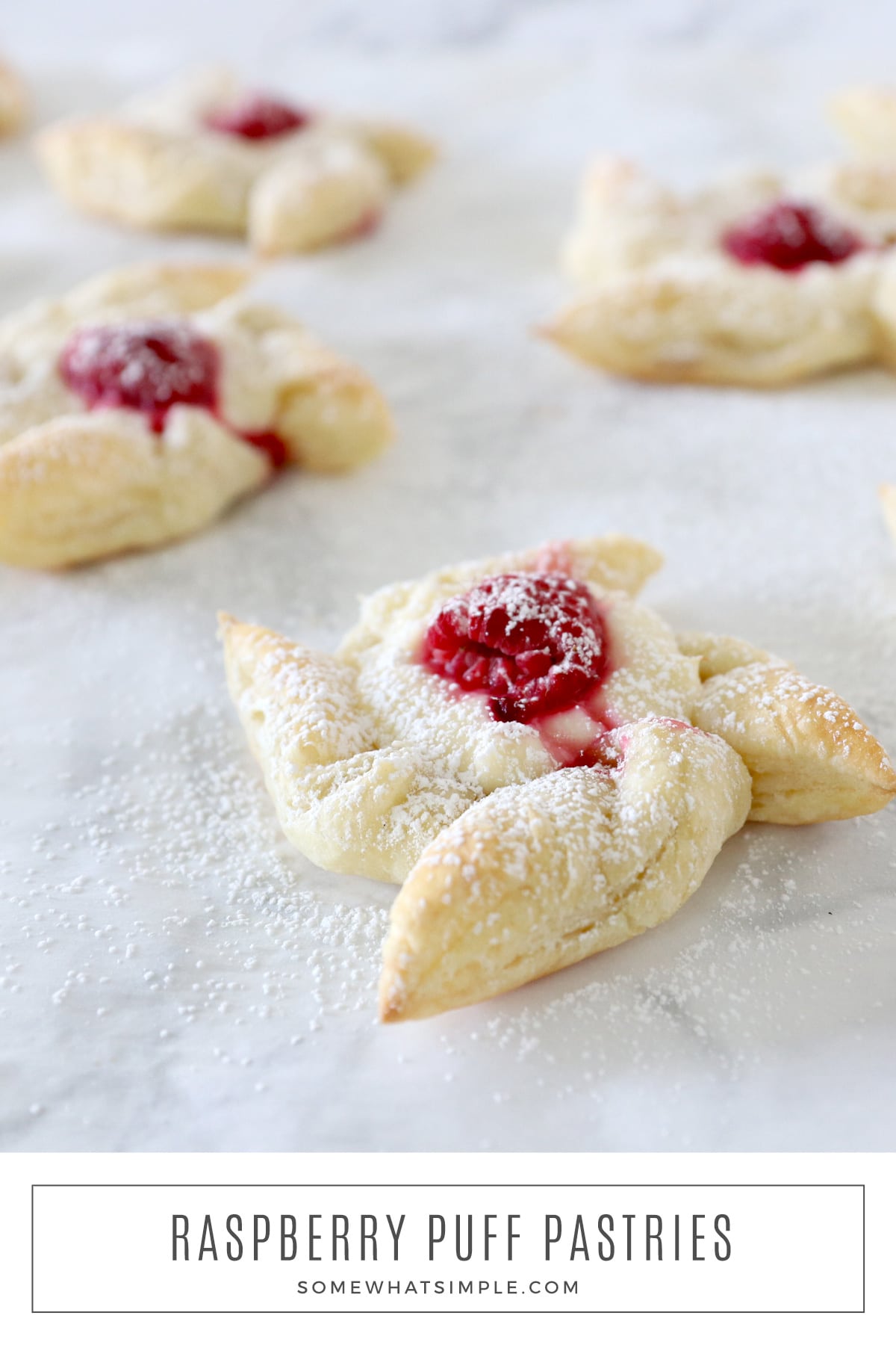 These easy raspberry pastries have only six ingredients and take just a few minutes to make! They look impressive and taste delicious! via @somewhatsimple