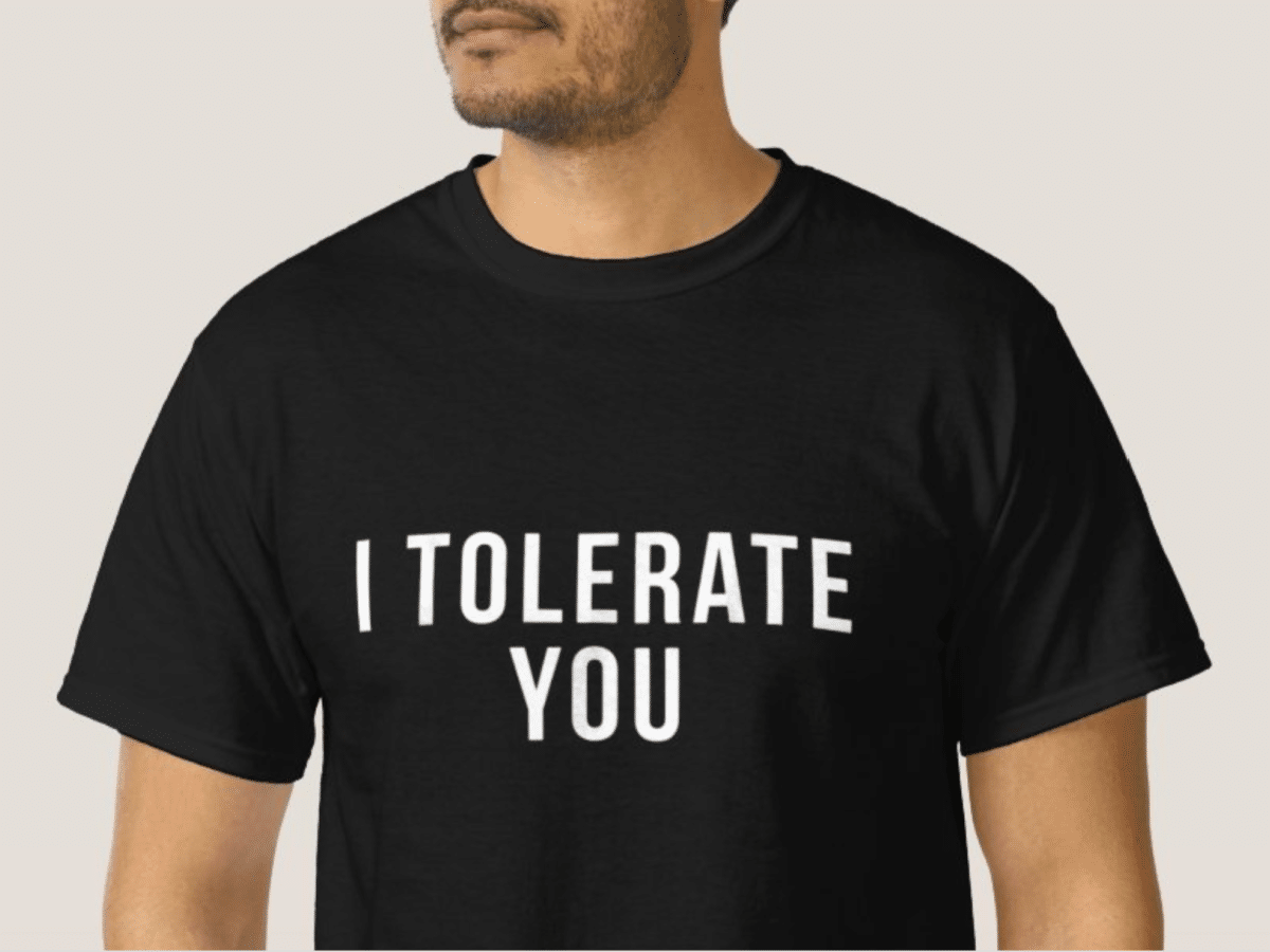 man wearing a black shirt that says i tolerate you