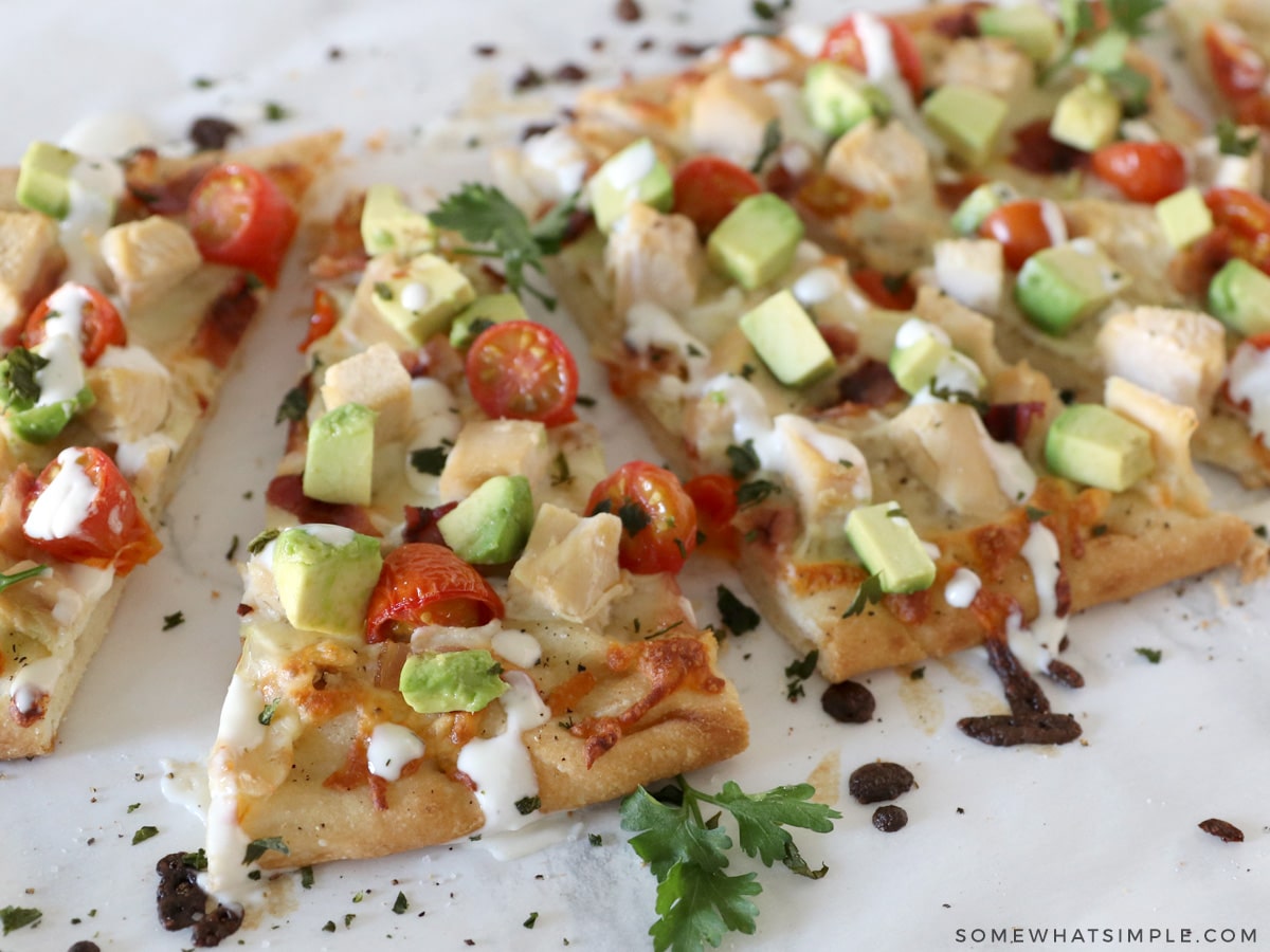 california chicken flatbread sliced in triangles on the counter