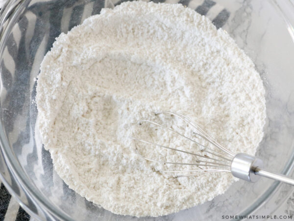 whisking the dry ingredients in a glass bowl