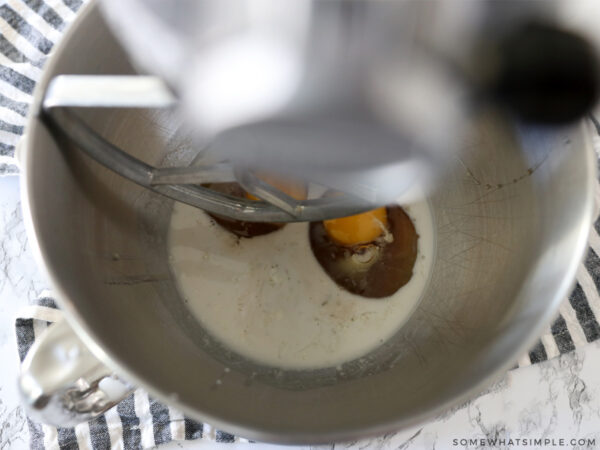 adding wet ingredients to a Kitchenaide