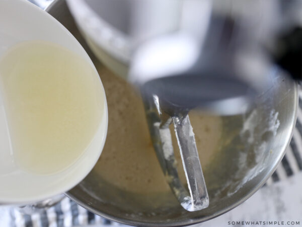 adding coconut milk to a mixing bowl