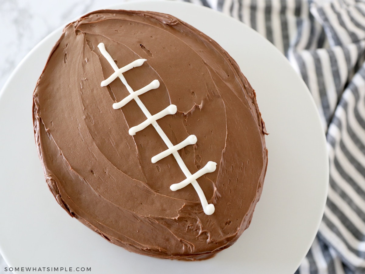 finished football cake on a white cake stand