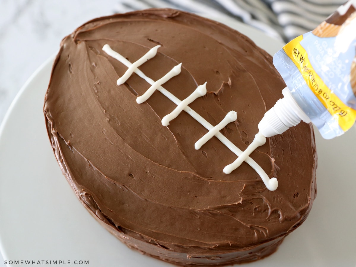 frosting a chocolate cake to look like a football
