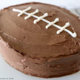 easy football cake on a white cake platter