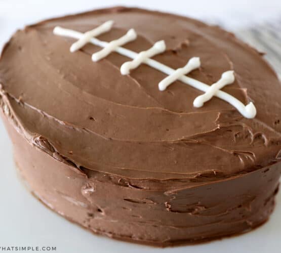 easy football cake on a white cake platter