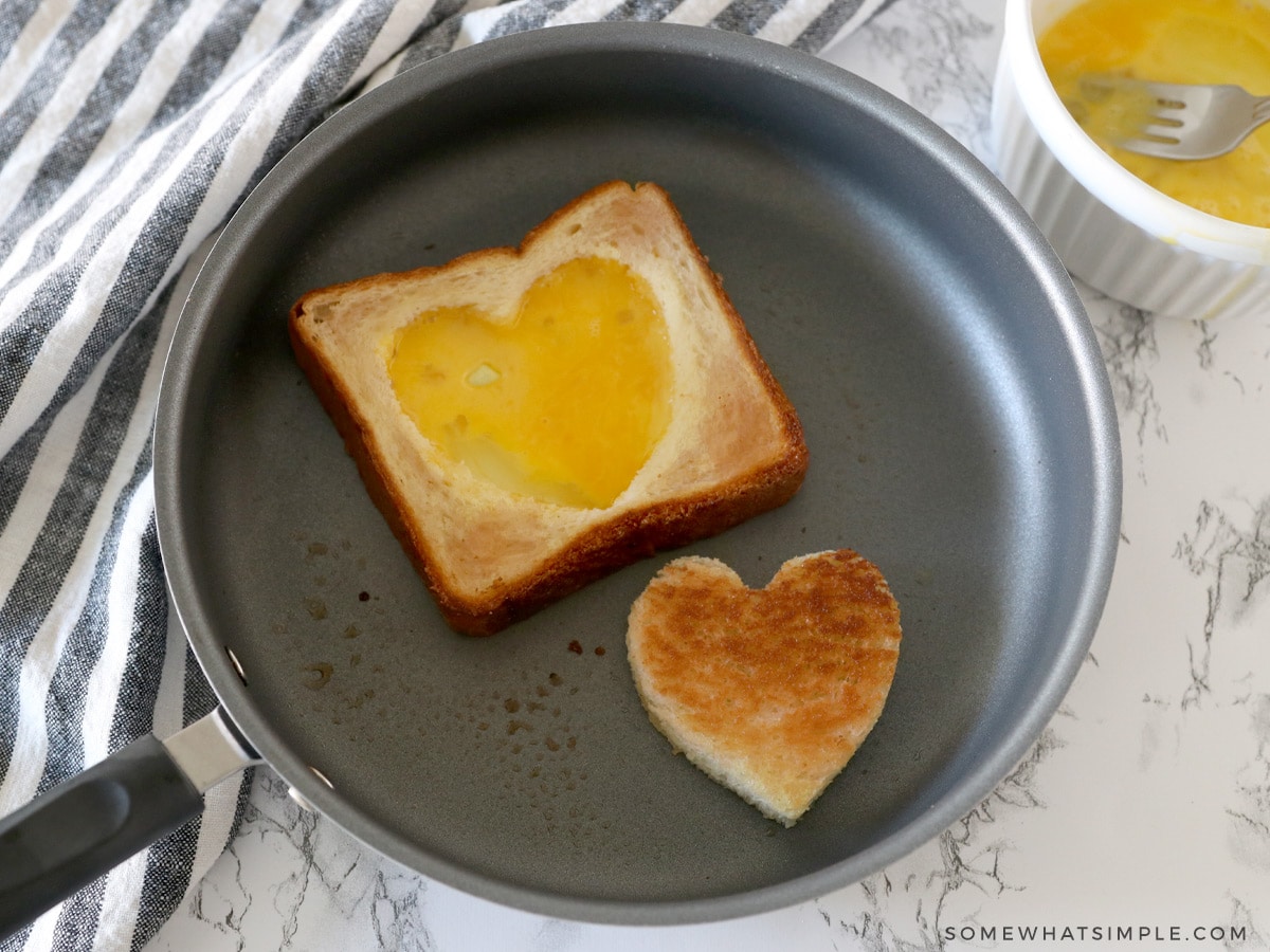 cracked egg in toast in a small pan