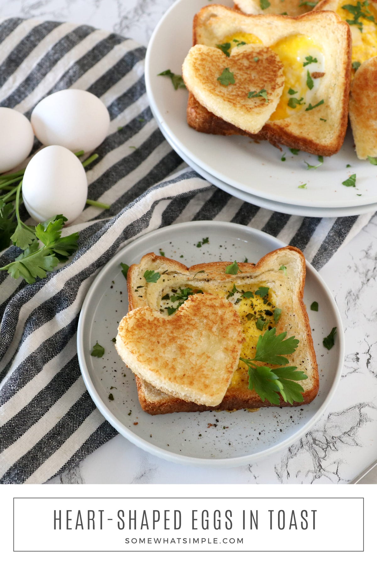 The easiest way to make Heart-Shaped Eggs in Toast that’s delicious, ready in five minutes, and absolutely perfect for Valentine's Day! via @somewhatsimple
