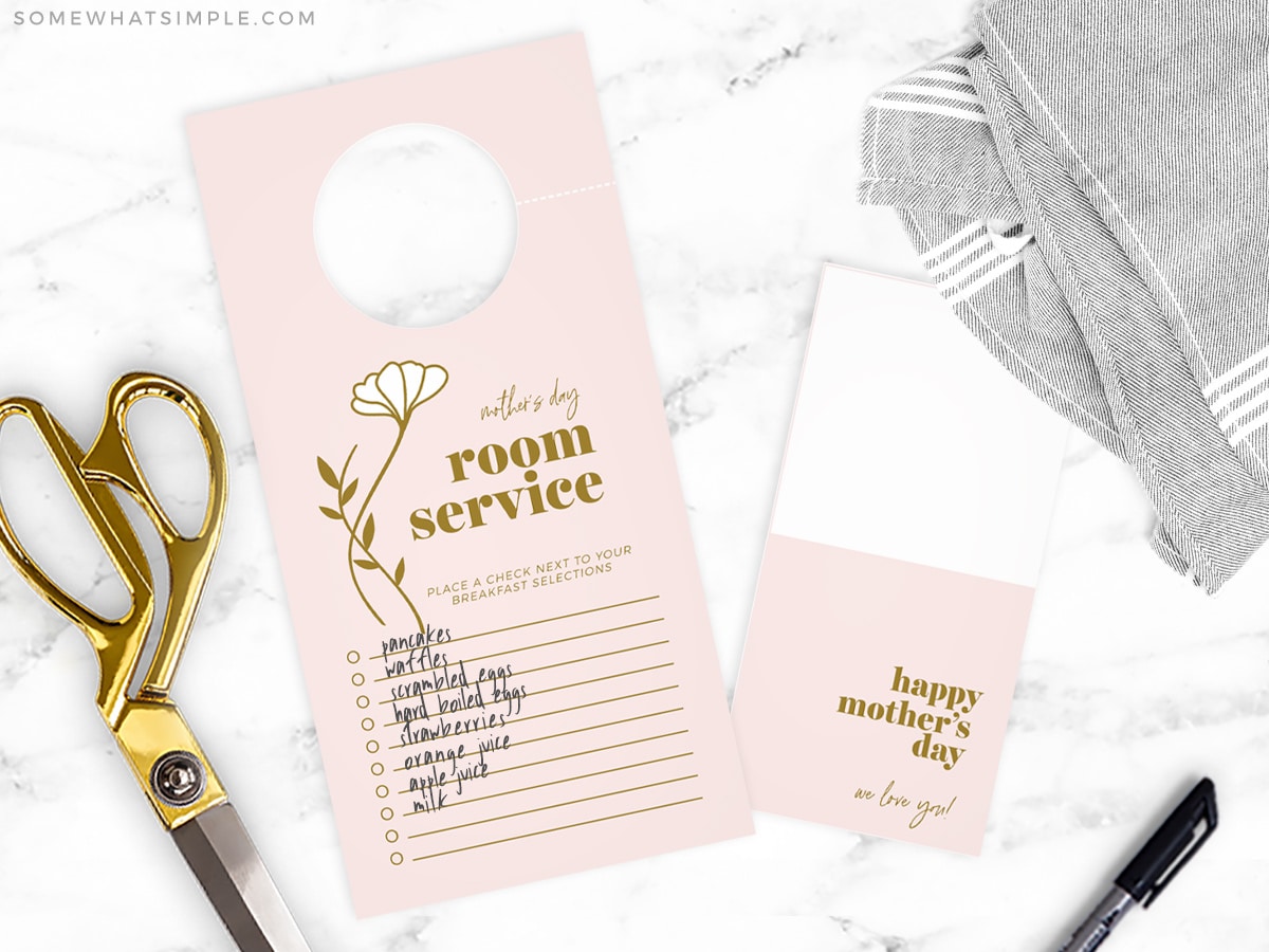 printable door hanger for breakfast in bed next to gold scissors