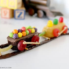 adding candy to snack cakes to make them look like train cars