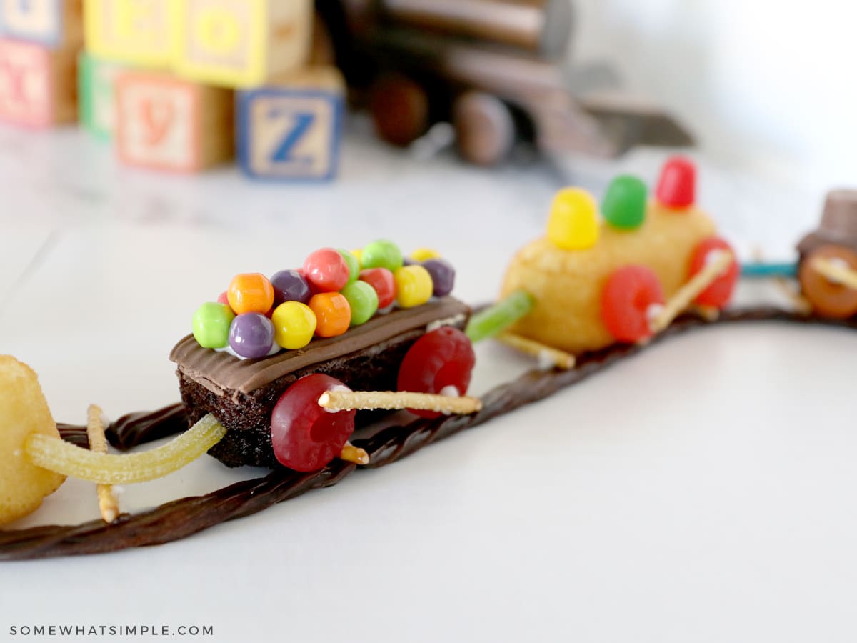 adding candy to snack cakes to make them look like train cars