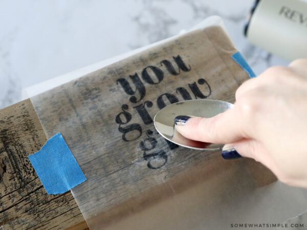 rubbing a design on wood