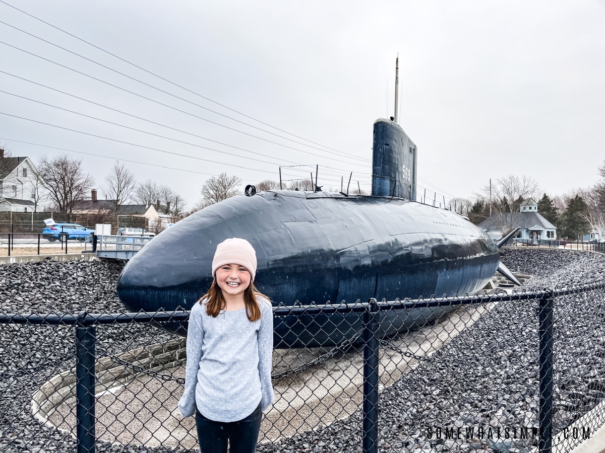 addie standing in front of the uss albacore