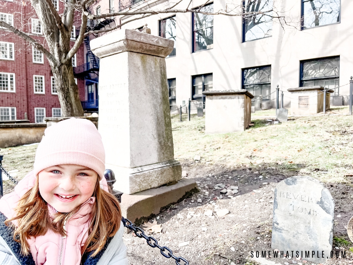 addison standing next to paul revere's grave