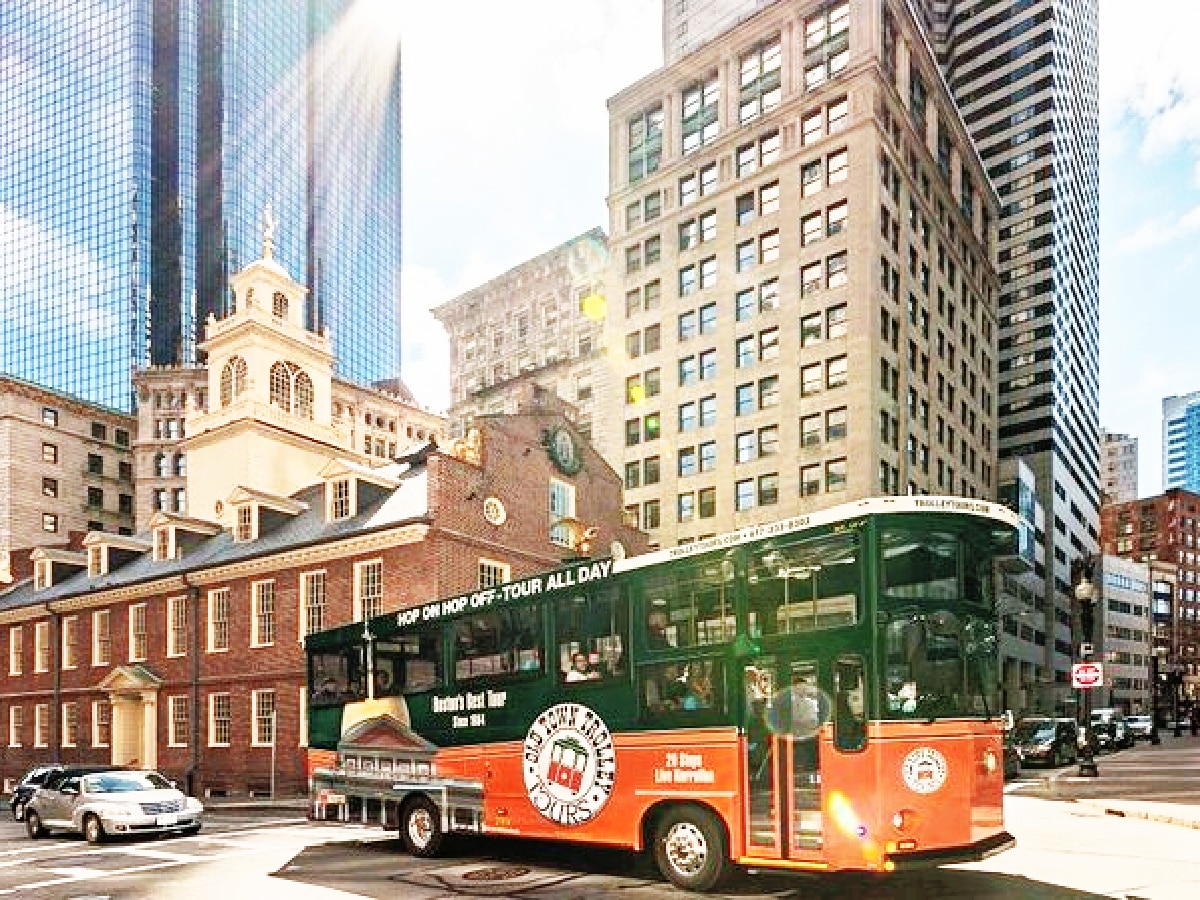 orange a green trolley in boston