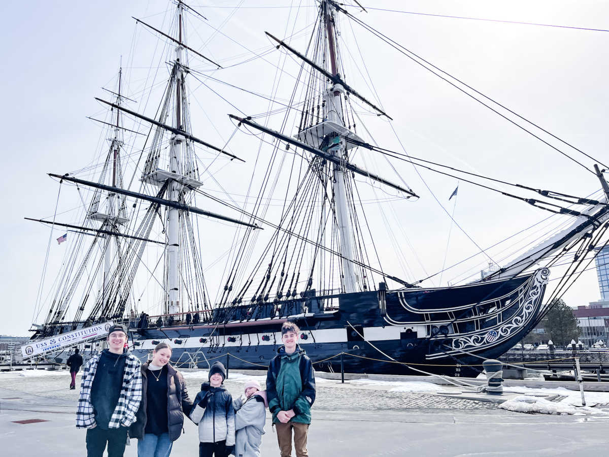 kids standing in front of the uss constitution