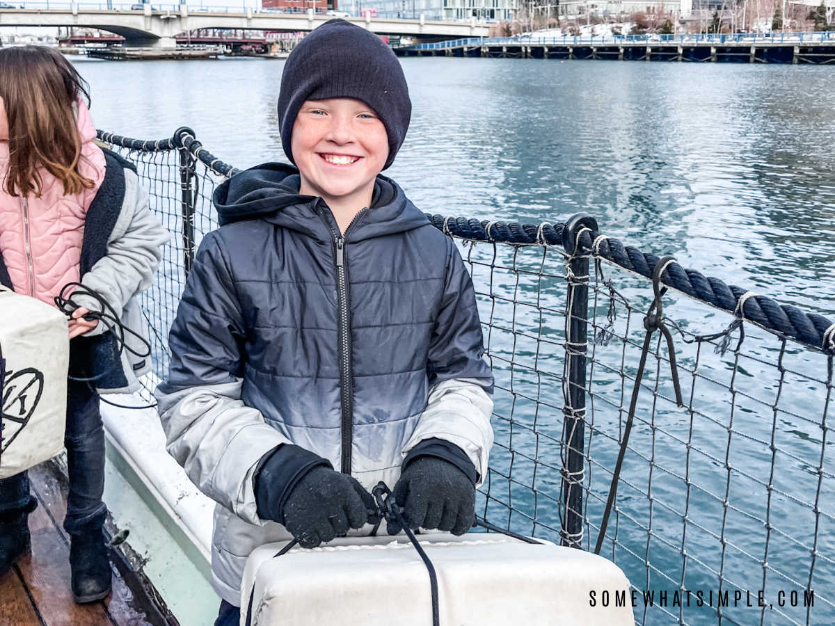 mason getting ready to toss tea into the harbor