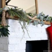 close up of a mantle with garland on it