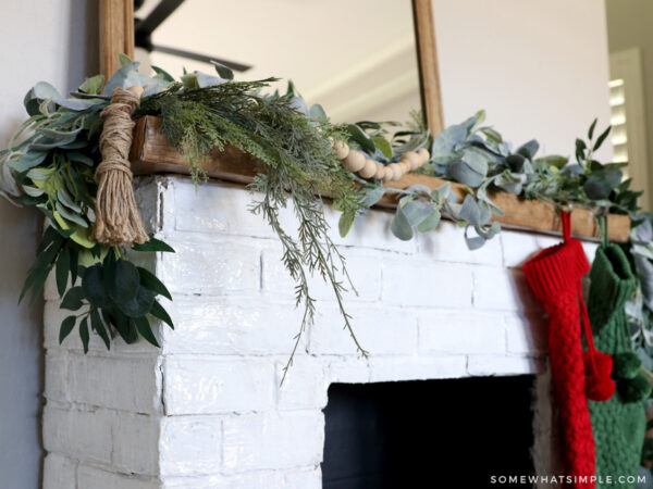 close up of a mantle with garland on it