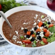 homemade refried beans in a white bowl