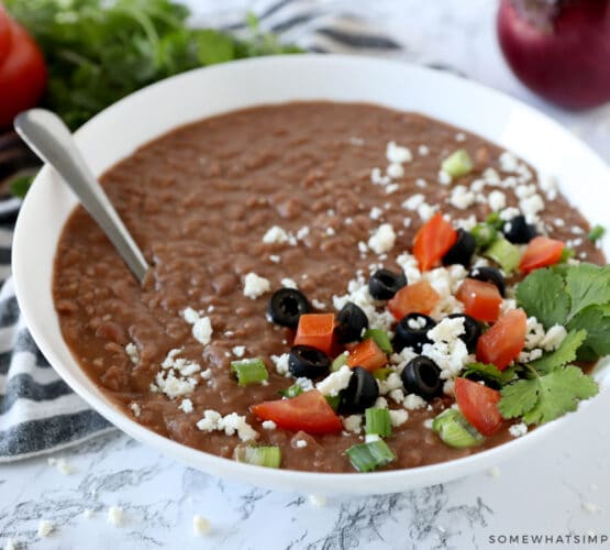 homemade refried beans in a white bowl