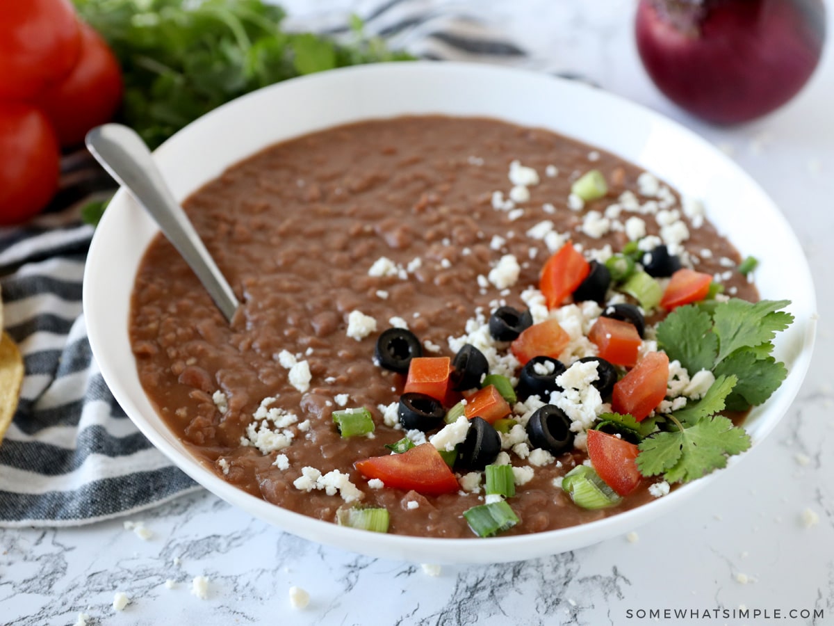 homemade refried beans in a white bowl