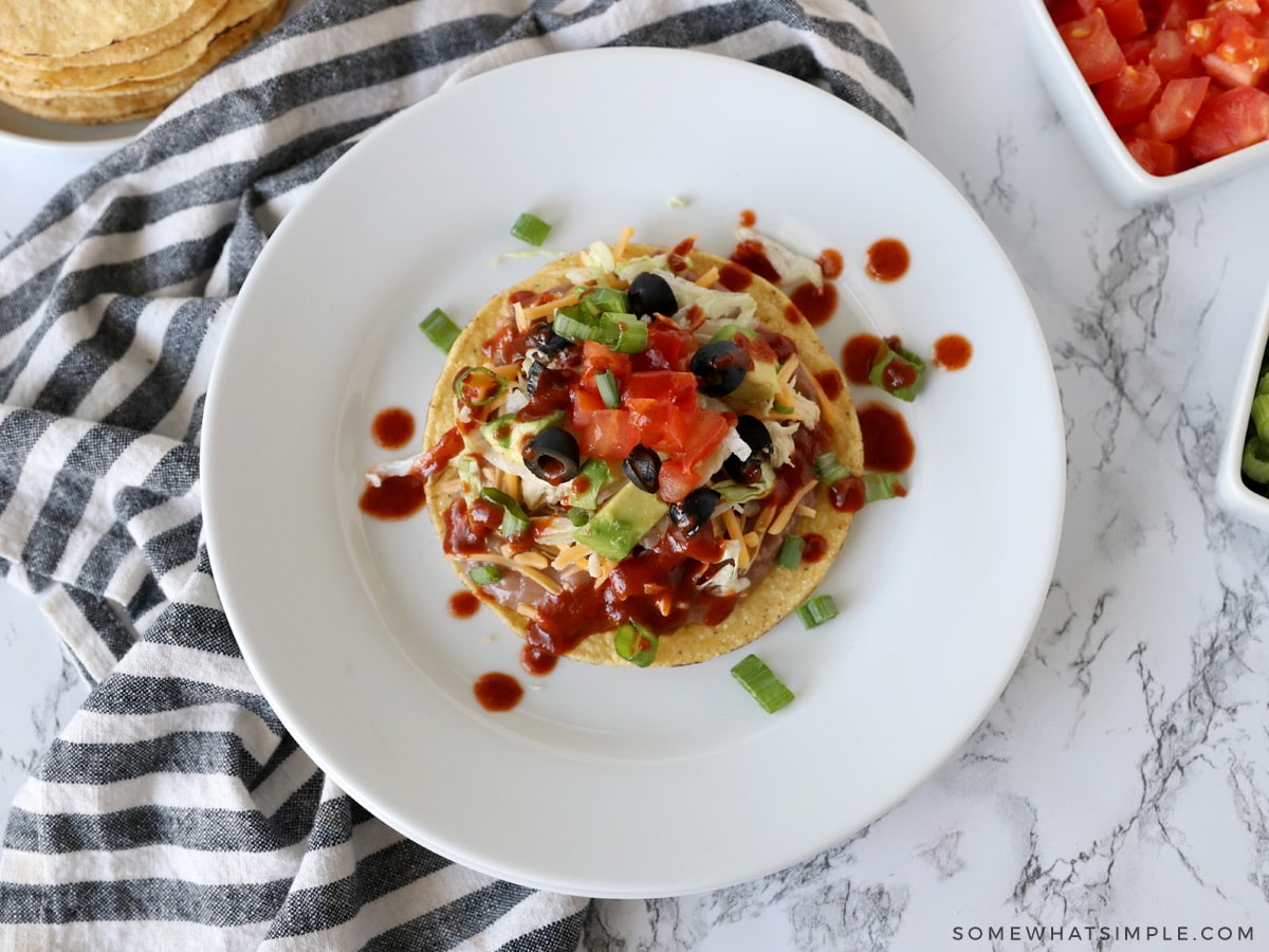 overhead shot of a tostada with a bunch of toppings