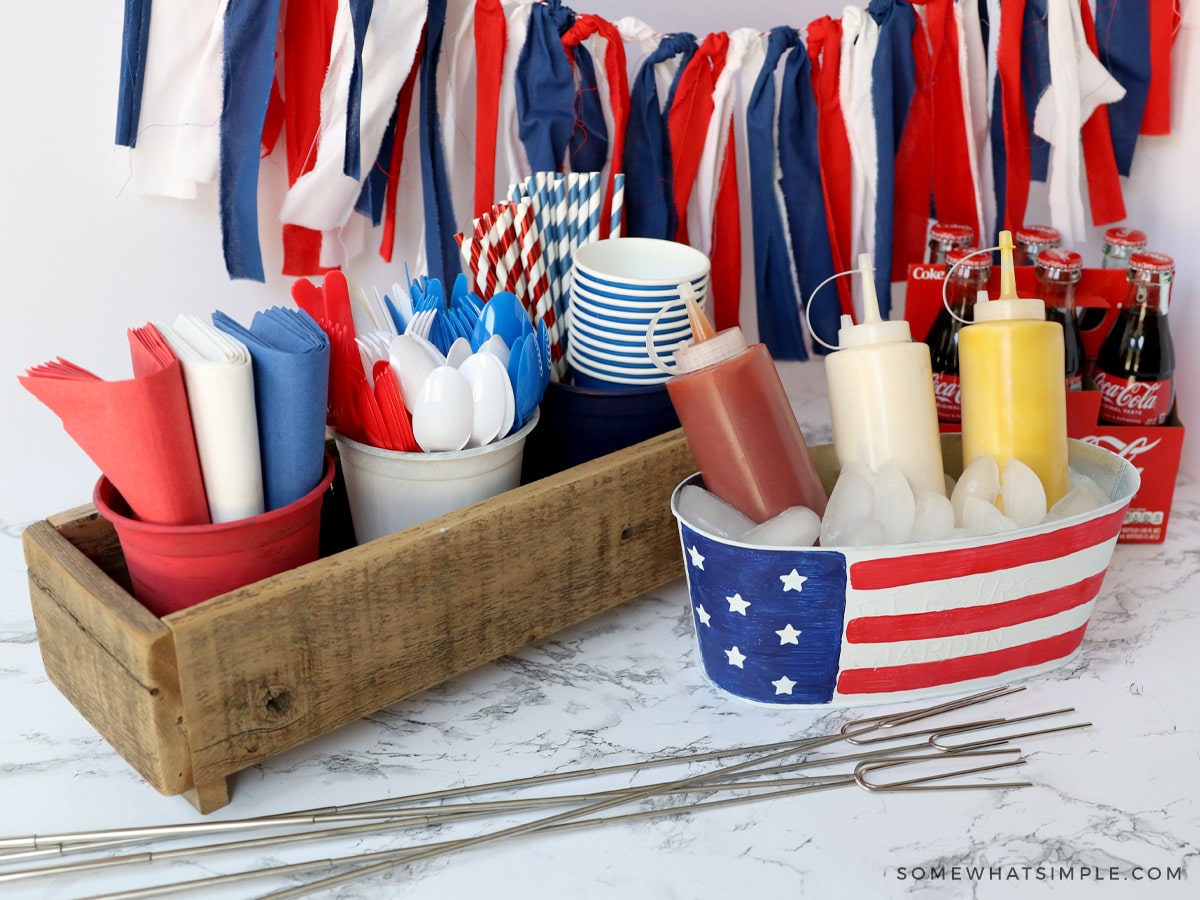 all pieces of a condiment station for a 4th of July BBQ