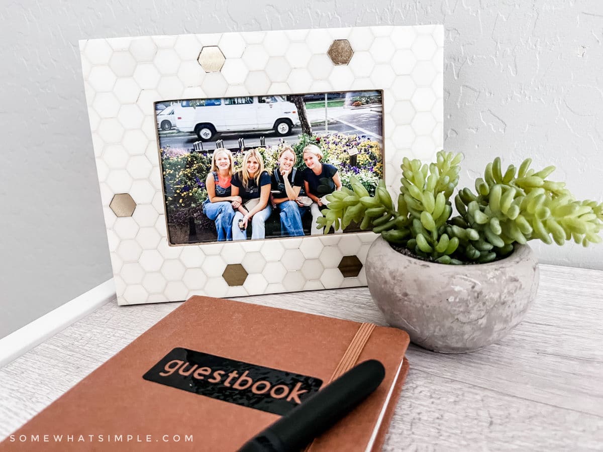 frame with pictures of college roommates and a guestbook