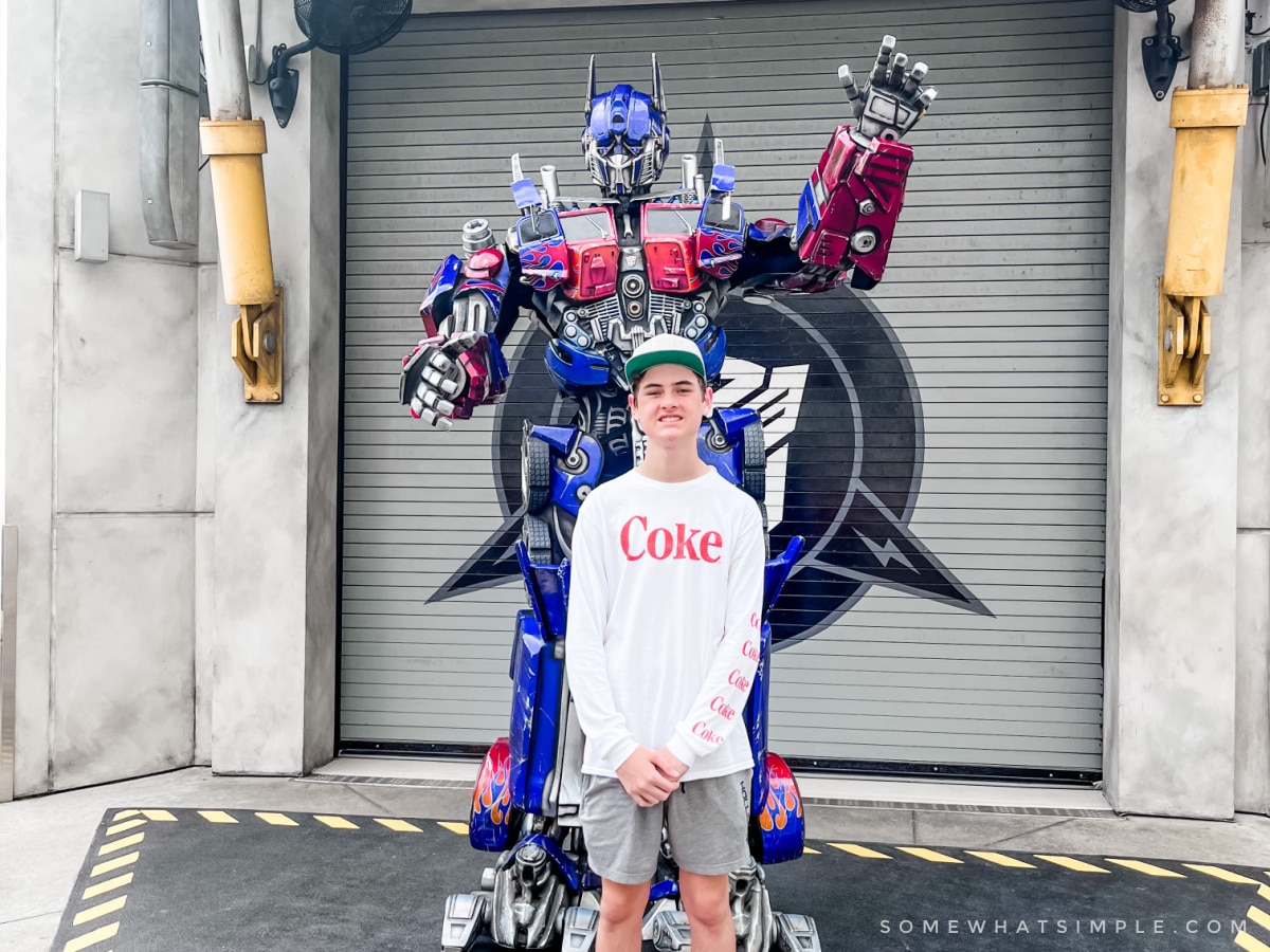 ryan standing with optimus prime