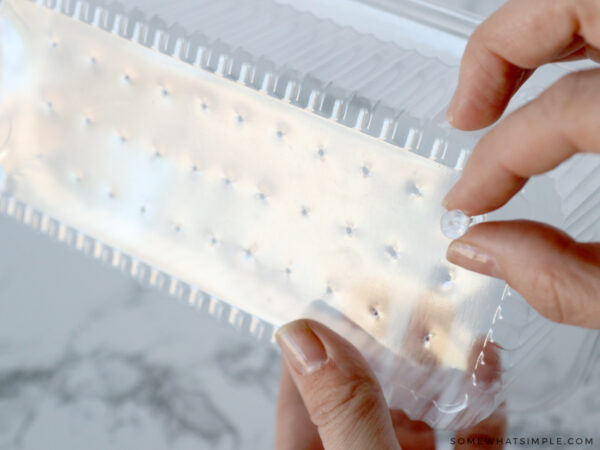 poking holes in the lid of a plastic loaf pan