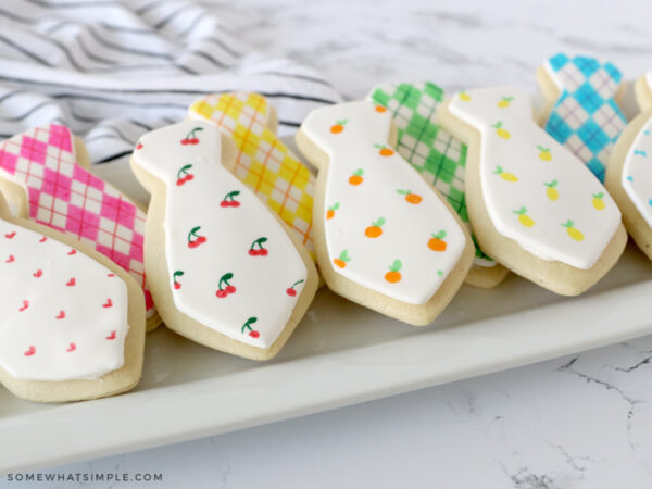 father's day tie cookies on a white platter