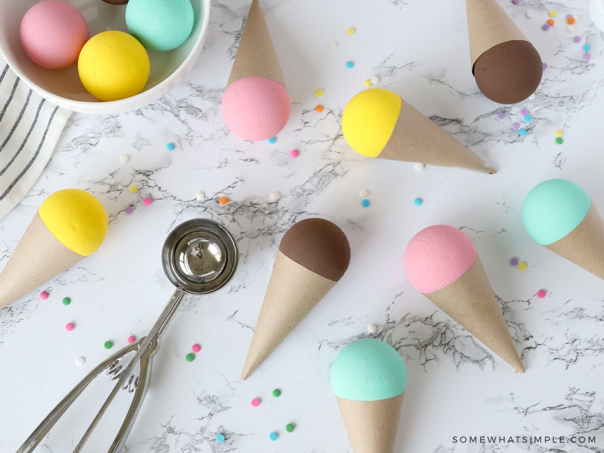 paper ice cream cones and foam balls on a white counter