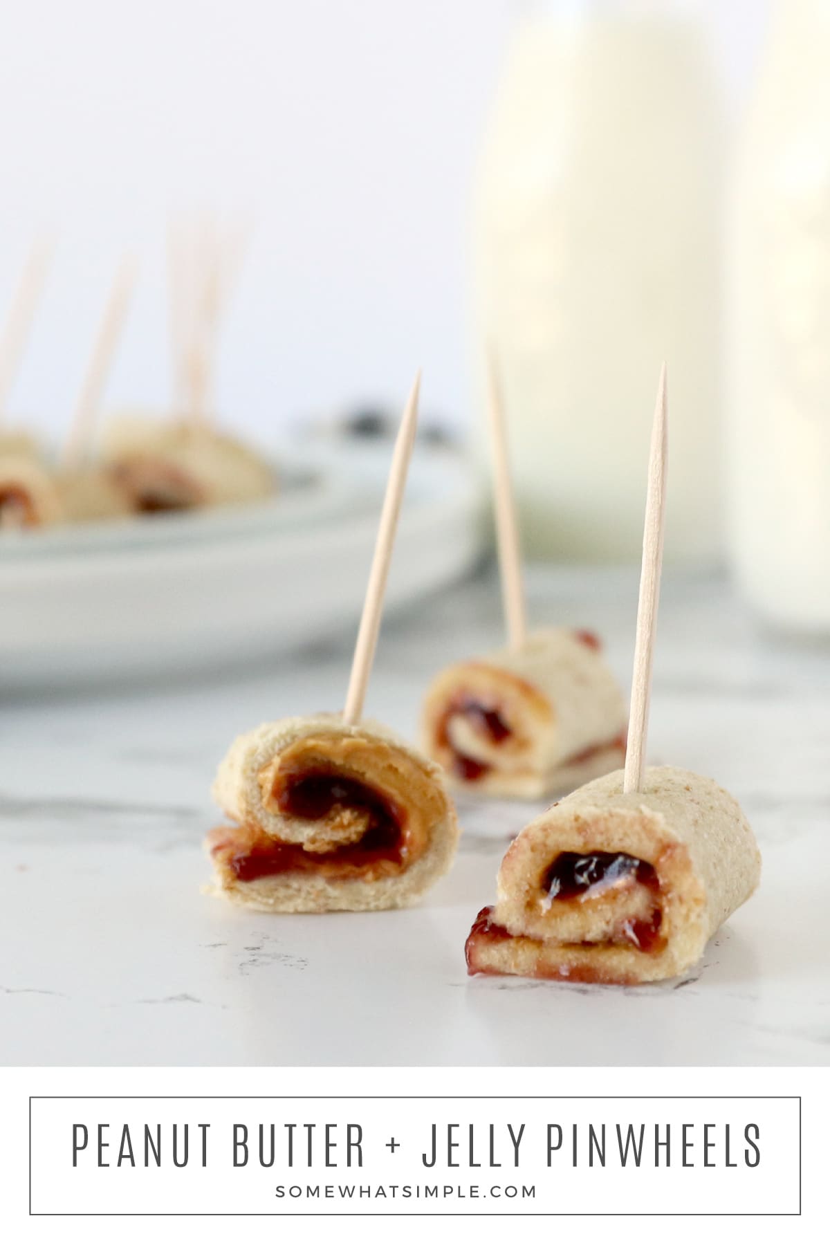 Easy to make and fun to devour, these peanut butter and jelly pinwheel sandwiches make the perfect lunch or snack! via @somewhatsimple