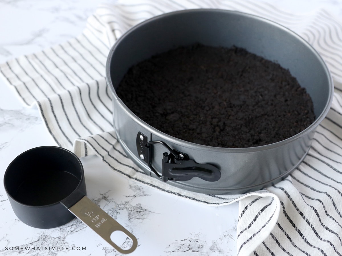 adding oreo crust to a springform pan