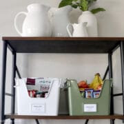 2 cute bins on a shelf full of snacks