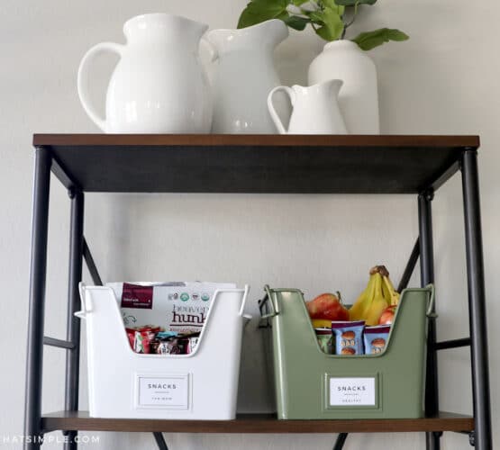 2 cute bins on a shelf full of snacks