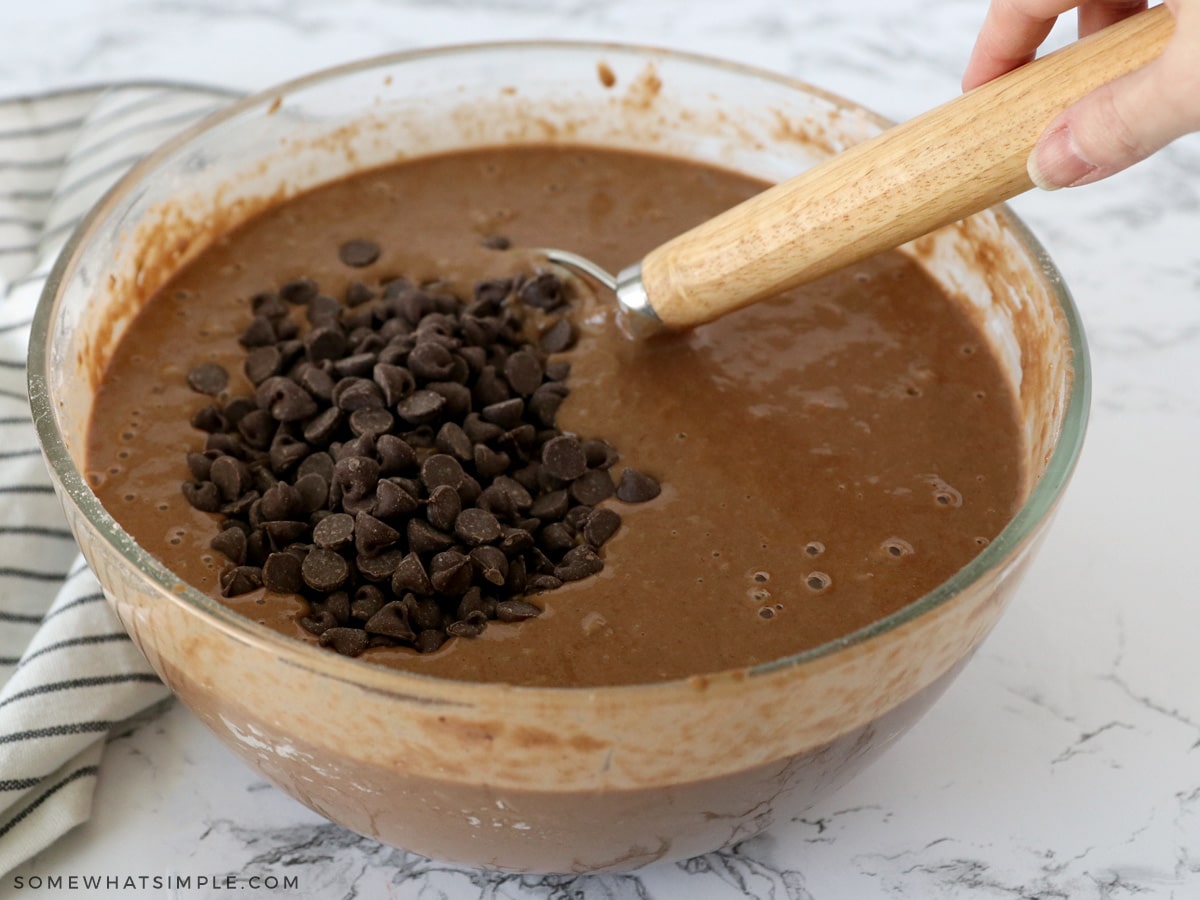 adding chocolate chips to zucchini bread batter