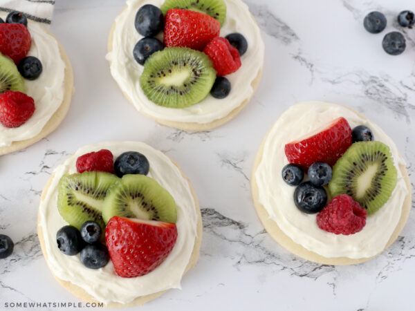 finished fruit pizza cookies with strawberries, kiwi, and blueberries