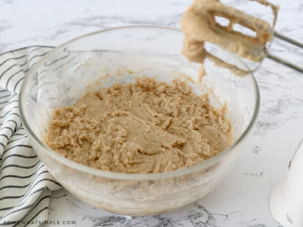 combining wet and dry ingredients in a glass bowl